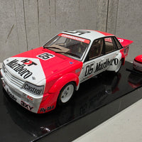 PETER BROCK - LARRY PERKINS - HOLDEN DEALER TEAM - VK COMMODORE - 1984 BATHURST WINNER - 1:18 SCALE DIECAST WITH HELMET - BIANTE