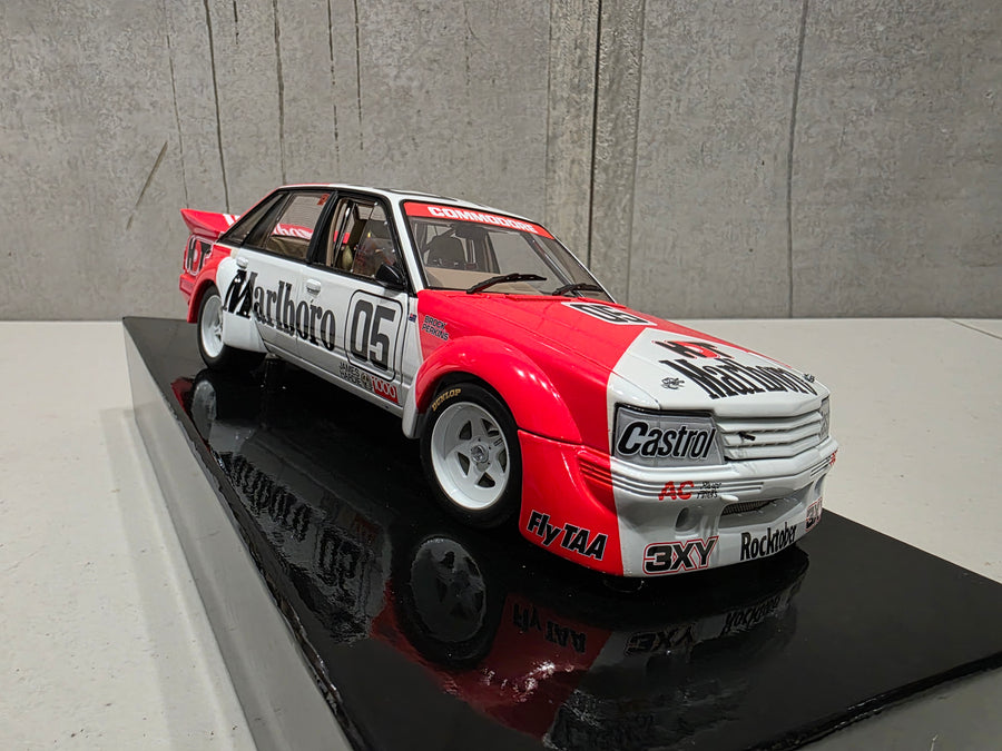PETER BROCK - LARRY PERKINS - HOLDEN DEALER TEAM - VK COMMODORE - 1984 BATHURST WINNER - 1:18 SCALE DIECAST WITH HELMET - BIANTE