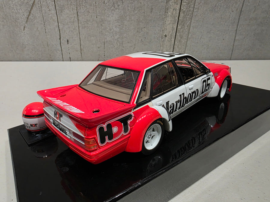 PETER BROCK - LARRY PERKINS - HOLDEN DEALER TEAM - VK COMMODORE - 1984 BATHURST WINNER - 1:18 SCALE DIECAST WITH HELMET - BIANTE